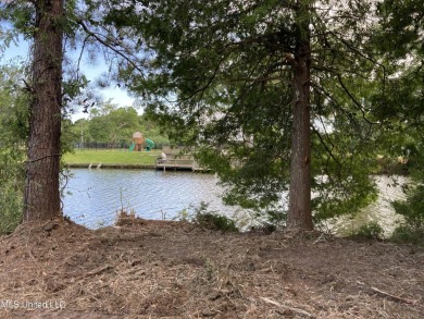 Your Gulf Coast Escape Awaits! Imagine waking up to the sound of on Pass Christian Isles Golf Club in Mississippi - for sale on GolfHomes.com, golf home, golf lot