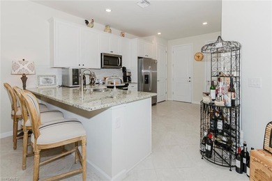 Enjoy expansive, tranquil water and golf course views that you on Panther Run Golf Club in Florida - for sale on GolfHomes.com, golf home, golf lot