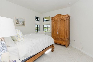 Enjoy expansive, tranquil water and golf course views that you on Panther Run Golf Club in Florida - for sale on GolfHomes.com, golf home, golf lot