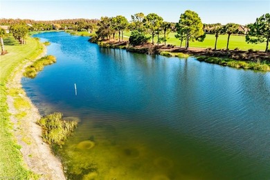 Enjoy expansive, tranquil water and golf course views that you on Panther Run Golf Club in Florida - for sale on GolfHomes.com, golf home, golf lot