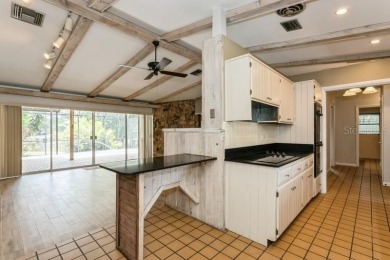 Tucked inside a charming Cul de sac, this 3 bedroom, 2 bath plus on The Dunedin Country Club in Florida - for sale on GolfHomes.com, golf home, golf lot
