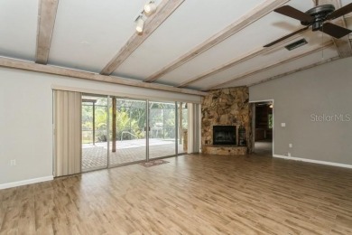 Tucked inside a charming Cul de sac, this 3 bedroom, 2 bath plus on The Dunedin Country Club in Florida - for sale on GolfHomes.com, golf home, golf lot