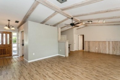 Tucked inside a charming Cul de sac, this 3 bedroom, 2 bath plus on The Dunedin Country Club in Florida - for sale on GolfHomes.com, golf home, golf lot