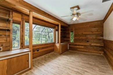 Tucked inside a charming Cul de sac, this 3 bedroom, 2 bath plus on The Dunedin Country Club in Florida - for sale on GolfHomes.com, golf home, golf lot