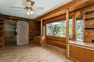 Tucked inside a charming Cul de sac, this 3 bedroom, 2 bath plus on The Dunedin Country Club in Florida - for sale on GolfHomes.com, golf home, golf lot