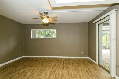 Tucked inside a charming Cul de sac, this 3 bedroom, 2 bath plus on The Dunedin Country Club in Florida - for sale on GolfHomes.com, golf home, golf lot