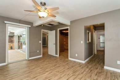 Tucked inside a charming Cul de sac, this 3 bedroom, 2 bath plus on The Dunedin Country Club in Florida - for sale on GolfHomes.com, golf home, golf lot
