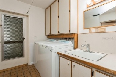 Tucked inside a charming Cul de sac, this 3 bedroom, 2 bath plus on The Dunedin Country Club in Florida - for sale on GolfHomes.com, golf home, golf lot
