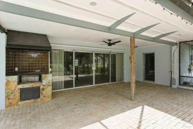 Tucked inside a charming Cul de sac, this 3 bedroom, 2 bath plus on The Dunedin Country Club in Florida - for sale on GolfHomes.com, golf home, golf lot