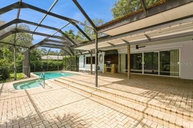 Tucked inside a charming Cul de sac, this 3 bedroom, 2 bath plus on The Dunedin Country Club in Florida - for sale on GolfHomes.com, golf home, golf lot