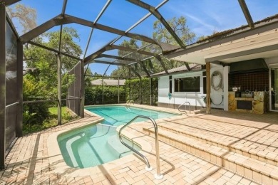 Tucked inside a charming Cul de sac, this 3 bedroom, 2 bath plus on The Dunedin Country Club in Florida - for sale on GolfHomes.com, golf home, golf lot