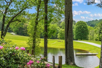Between two mountain ridges lies a broad grassy meadow where on Headwaters Golf Club in North Carolina - for sale on GolfHomes.com, golf home, golf lot