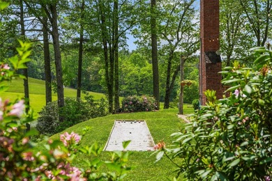 Between two mountain ridges lies a broad grassy meadow where on Headwaters Golf Club in North Carolina - for sale on GolfHomes.com, golf home, golf lot