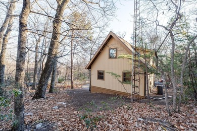 Escape to comfort and nature in this inviting 2BR/2BA bungalow on Woodstone Meadows Golf Course At Massanutten in Virginia - for sale on GolfHomes.com, golf home, golf lot