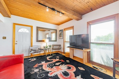This two bedroom one and a half bath charming farm house built on Grosse Ile Golf and Country Club in Michigan - for sale on GolfHomes.com, golf home, golf lot