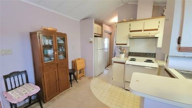 TWO BEDROOM, 1 1/2 BATHROOM MOBILE HOME IN ACTIVE 55+ COMMUNITY on River Run Golf Links in Florida - for sale on GolfHomes.com, golf home, golf lot