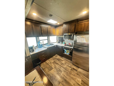 Adorable, newer camper with fabulous attached covered porch. 1 on North Shore Country Club in North Carolina - for sale on GolfHomes.com, golf home, golf lot