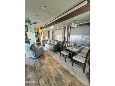 Adorable, newer camper with fabulous attached covered porch. 1 on North Shore Country Club in North Carolina - for sale on GolfHomes.com, golf home, golf lot