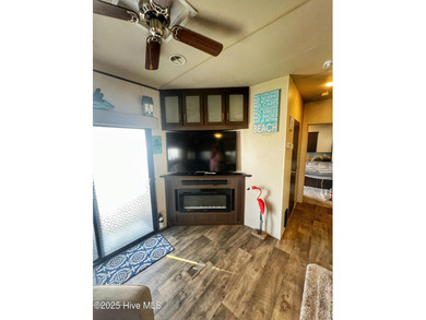 Adorable, newer camper with fabulous attached covered porch. 1 on North Shore Country Club in North Carolina - for sale on GolfHomes.com, golf home, golf lot