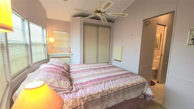 TWO BEDROOM, 1 1/2 BATHROOM MOBILE HOME IN ACTIVE 55+ COMMUNITY on River Run Golf Links in Florida - for sale on GolfHomes.com, golf home, golf lot