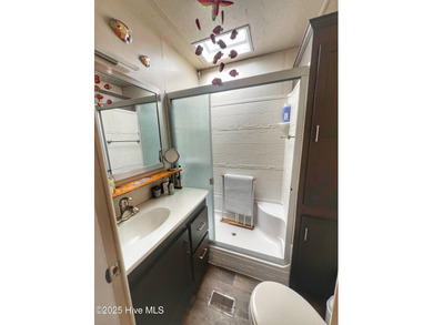 Adorable, newer camper with fabulous attached covered porch. 1 on North Shore Country Club in North Carolina - for sale on GolfHomes.com, golf home, golf lot