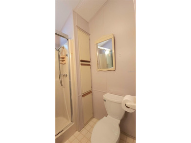 TWO BEDROOM, 1 1/2 BATHROOM MOBILE HOME IN ACTIVE 55+ COMMUNITY on River Run Golf Links in Florida - for sale on GolfHomes.com, golf home, golf lot