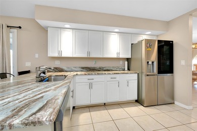 Welcome to this beautifully updated pool home on a spacious on Port Charlotte Golf Club in Florida - for sale on GolfHomes.com, golf home, golf lot