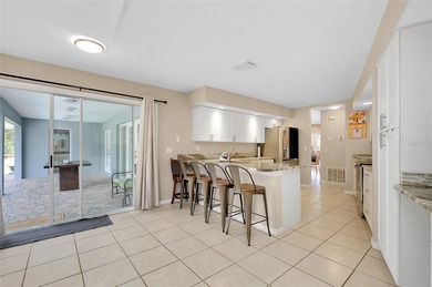 Welcome to this beautifully updated pool home on a spacious on Port Charlotte Golf Club in Florida - for sale on GolfHomes.com, golf home, golf lot