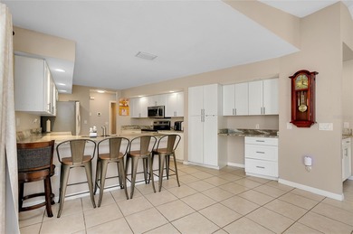 Welcome to this beautifully updated pool home on a spacious on Port Charlotte Golf Club in Florida - for sale on GolfHomes.com, golf home, golf lot