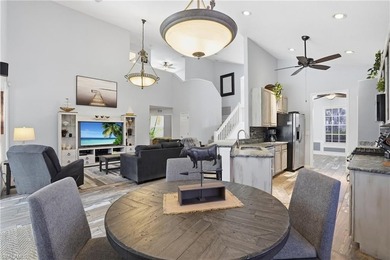 Experience sweeping 180-degree water and golf course views from on  in Florida - for sale on GolfHomes.com, golf home, golf lot