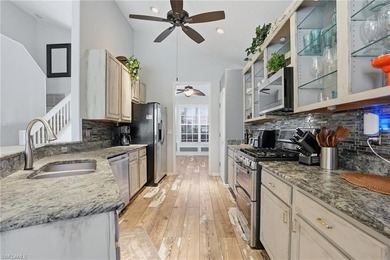 Experience sweeping 180-degree water and golf course views from on  in Florida - for sale on GolfHomes.com, golf home, golf lot