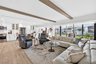 Enjoy relaxed coastal living at Sunset South in this first floor on Beachview Golf Club in Florida - for sale on GolfHomes.com, golf home, golf lot