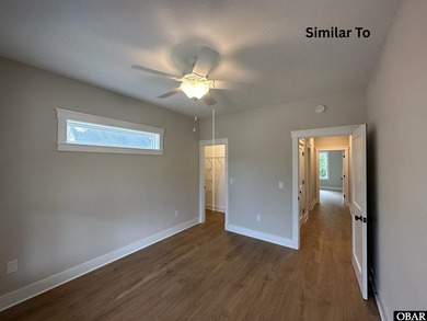 Experience the perfect blend of timeless architecture and on The Currituck Golf Club in North Carolina - for sale on GolfHomes.com, golf home, golf lot