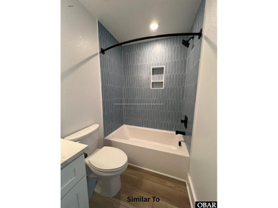 Experience the perfect blend of timeless architecture and on The Currituck Golf Club in North Carolina - for sale on GolfHomes.com, golf home, golf lot