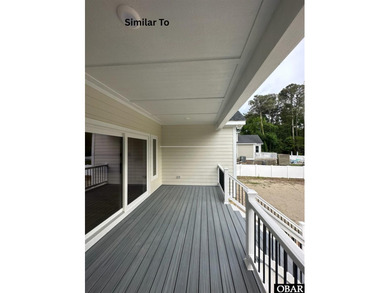 Experience the perfect blend of timeless architecture and on The Currituck Golf Club in North Carolina - for sale on GolfHomes.com, golf home, golf lot