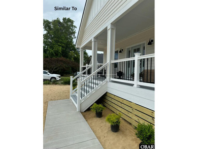 Experience the perfect blend of timeless architecture and on The Currituck Golf Club in North Carolina - for sale on GolfHomes.com, golf home, golf lot