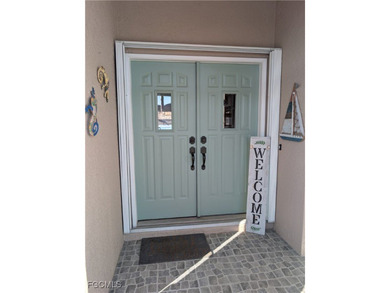 Discover Florida waterfront living at its finest in this on Burnt Store Golf Club in Florida - for sale on GolfHomes.com, golf home, golf lot