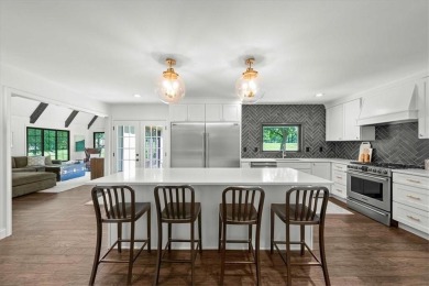 Welcome to this stunning 1.5-story Tudor-style home nestled on on Leawood South Country Club in Kansas - for sale on GolfHomes.com, golf home, golf lot
