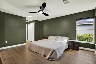 Wake up to panoramic water and fairway views from this fully on Links At Greenfield Plantation in Florida - for sale on GolfHomes.com, golf home, golf lot