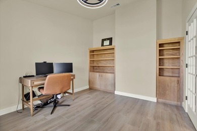 Wake up to panoramic water and fairway views from this fully on Links At Greenfield Plantation in Florida - for sale on GolfHomes.com, golf home, golf lot