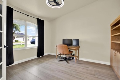 Wake up to panoramic water and fairway views from this fully on Links At Greenfield Plantation in Florida - for sale on GolfHomes.com, golf home, golf lot