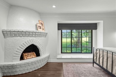 Welcome to this stunning 1.5-story Tudor-style home nestled on on Leawood South Country Club in Kansas - for sale on GolfHomes.com, golf home, golf lot