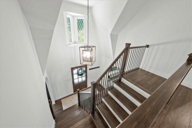 Welcome to this stunning 1.5-story Tudor-style home nestled on on Leawood South Country Club in Kansas - for sale on GolfHomes.com, golf home, golf lot