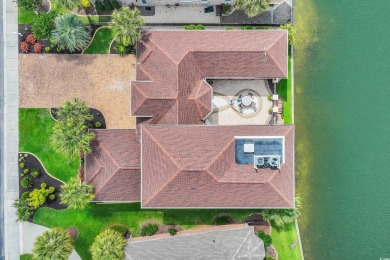 Discover the perfect blend of elegance and comfort in this on Surf Golf and Beach Club in South Carolina - for sale on GolfHomes.com, golf home, golf lot
