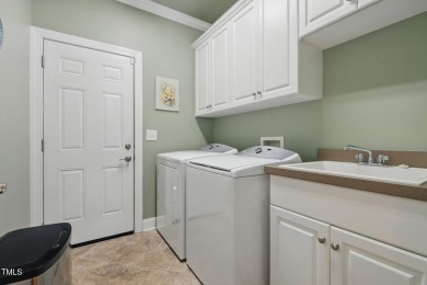 Perfectly positioned on a premium golf course lot overlooking on The Preserve At Jordan Lake Golf Club in North Carolina - for sale on GolfHomes.com, golf home, golf lot