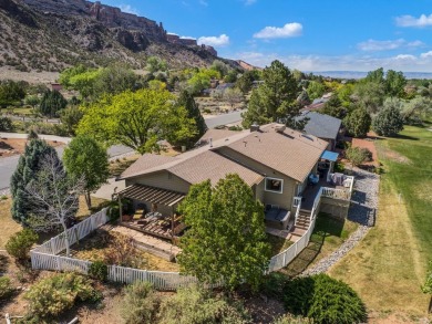 Nestled next to the majestic Colorado National Monument, this on Tiara Rado Golf Course in Colorado - for sale on GolfHomes.com, golf home, golf lot