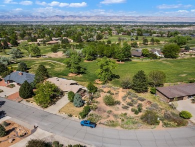Nestled next to the majestic Colorado National Monument, this on Tiara Rado Golf Course in Colorado - for sale on GolfHomes.com, golf home, golf lot