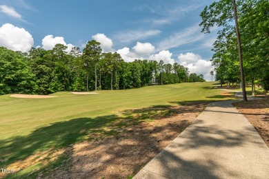 Perfectly positioned on a premium golf course lot overlooking on The Preserve At Jordan Lake Golf Club in North Carolina - for sale on GolfHomes.com, golf home, golf lot