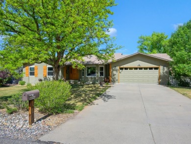 Nestled next to the majestic Colorado National Monument, this on Tiara Rado Golf Course in Colorado - for sale on GolfHomes.com, golf home, golf lot