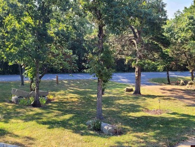 Nestled on two nice lots in the picturesque community of on The Course At Turkey Mountain in Arkansas - for sale on GolfHomes.com, golf home, golf lot